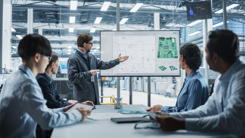 Head Of Engineering Presenting Motherboard For Powerful Microchips On TV Set