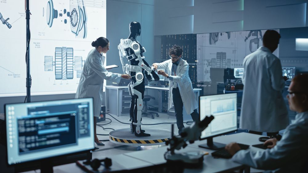 In Robotics Technology Development Laboratory A Team of Electrical and Mechanical Engineers Work on a Bionics Exoskeleton Prototype