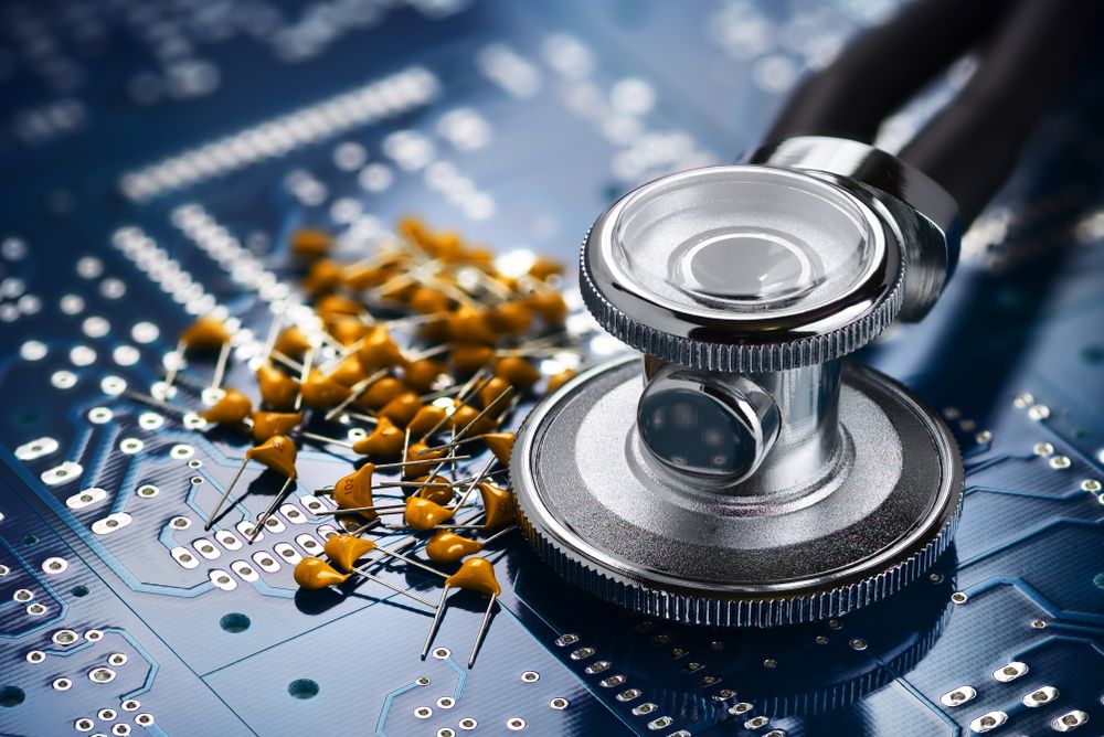 Medical stethoscope on the blue printed circuit board