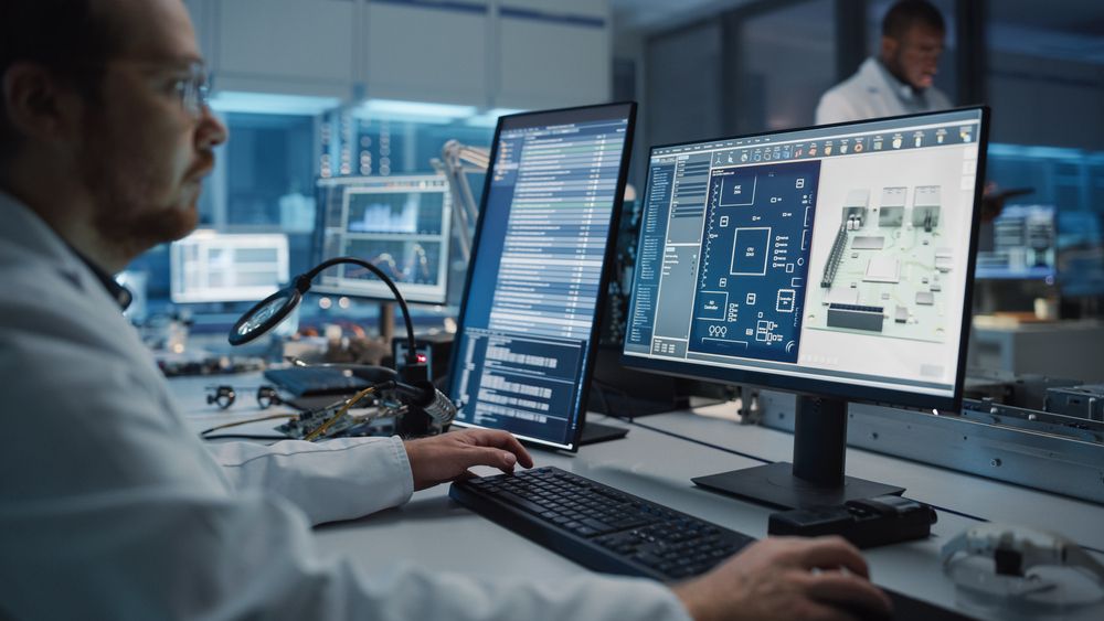 Modern Mechanical Engineer Works on Computer with CAD Software