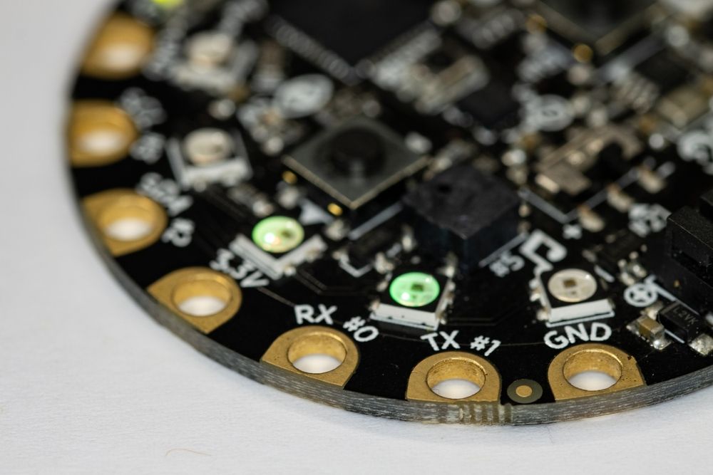 Round circular microcontroller for interaction design and wearable devices. Round wearable microcontroller with multicolored led blinking in circle