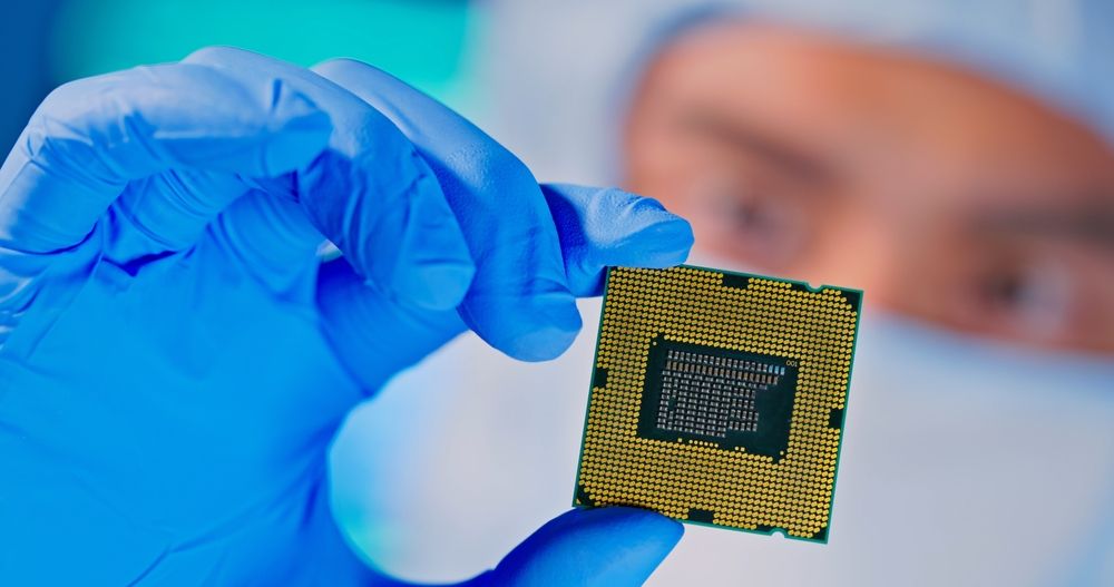 technician examines semiconductor