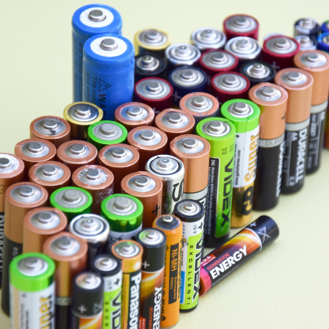 Close up view of assorted AA and AAA batteries from various brands and chemistries