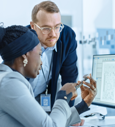 two engineers looking at a chip