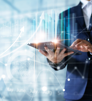 Man holding a tablet with charts floating around