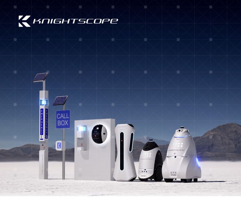 Photo of the Knightscope product line sitting on flats with mountains in the background